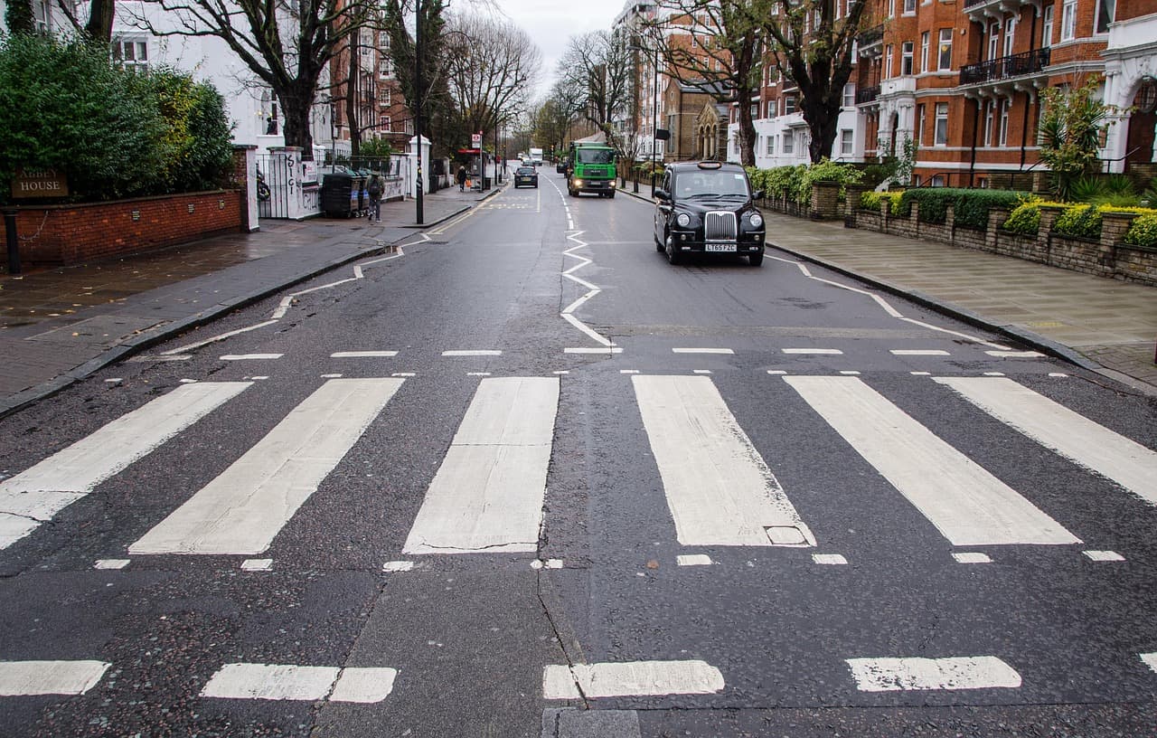 A zebra crossing on a tree-lined London residential street